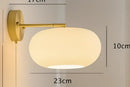 Vintage brass ceramic wall lamp with ribbed glass shade for bedroom