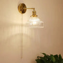 Vintage brass wall lamp with ribbed glass shade for living room