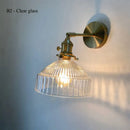 Vintage brass wall lamp with ribbed glass shade for living room