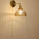 Vintage brass wall lamp with ribbed glass shade for living room