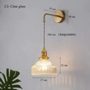 Vintage brass wall lamp with ribbed glass shade for living room