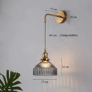 Vintage brass wall lamp with ribbed glass shade for living room