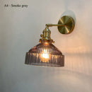 Vintage brass wall lamp with ribbed glass shade for living room