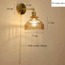 Vintage brass wall lamp with ribbed glass shade for living room