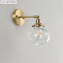 DecorBites™ Champagne/Clear Prismatic Glass Single Sconce Gold Wall Light - Minimalist Globe Design