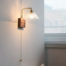 Vintage brass wall light with etched clear glass bedroom sconce