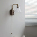 Vintage brass wall light with etched clear glass bedroom sconce