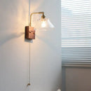 Vintage brass wall light with etched clear glass bedroom sconce