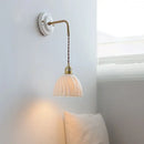 Vintage ceramic wall sconce with copper arm – bedroom pull chain lamp