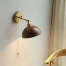 Walnut and brass wall sconce with pull chain switch bedroom light