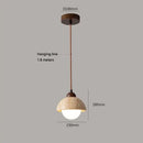 Warm textured concrete cave stone pendant light dining room