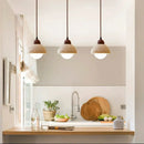 Warm textured concrete cave stone pendant light dining room