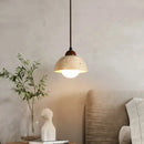 Warm textured concrete cave stone pendant light dining room