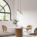Warm textured concrete cave stone pendant light dining room