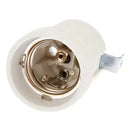 White ceramic lamp holder base with brass prongs for bedroom lighting