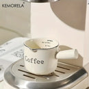 White ceramic measuring cups with silver rim – kitchen espresso tools