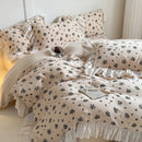 White floral cotton bedding set with lace ruffles for bedroom