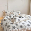 White floral cotton bedding set with lace ruffles for bedroom