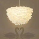 White floral pendant chandelier with feather accents for dining room