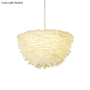White floral pendant chandelier with feather accents for dining room