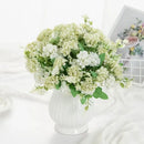 White hydrangea bouquet in ribbed glass vase for living room decor