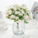 White hydrangea bouquet in ribbed glass vase for living room decor