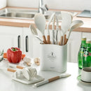 White silicone kitchen cookware set with wooden handles and holder