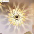 Wooden floral sunburst wall lamp orange & yellow bedroom light