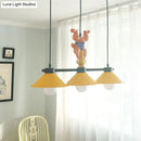 Yellow and orange monkey kitchen island pendant with yellow cone shades
