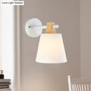Yellow macaron fabric wall light with wood accent bedroom sconce
