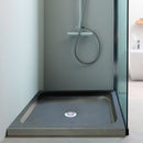 Black Basalt Square Shower Base Hand-carved from Solid Basalt Block (W)36" (L)36" (H)3" installed bathroom green walls and mint tone shower faucet