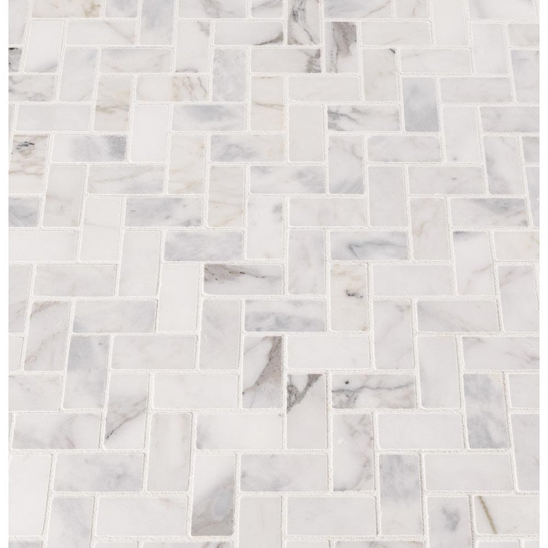 Calacatta cressa herringbone 12X12 honed marble mesh mounted mosaic tile SMOT-CALCRE-HBH product shot multiple tiles angle view