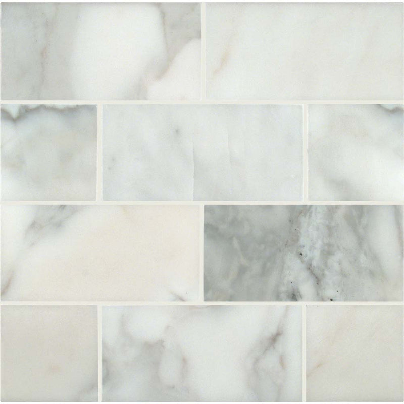 Calacatta gold 3 in-x 6 in polished marble floor and wall tile TCALAGOLD36P product shot multiple tiles top view