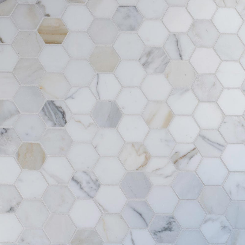 Calacatta gold hexagon 12X12 polished marble mesh mounted mosaic tile SMOT-CALAGOLD-2HEX product shot multiple tiles angle view