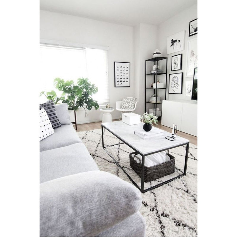Carrara White marble coffee table 24x48 black paint legs living room view