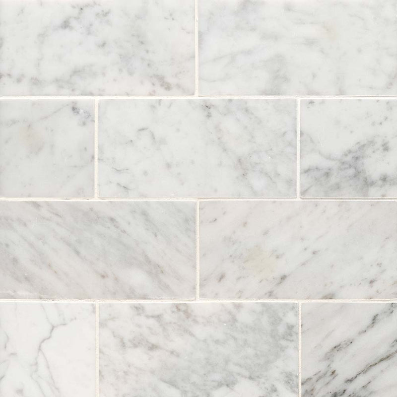 Carrara-white-3-in-x-6-in-honed-marble-floor-and-wall-tile-TCARWHT36H-product-shot-multiple-tiles-top-view