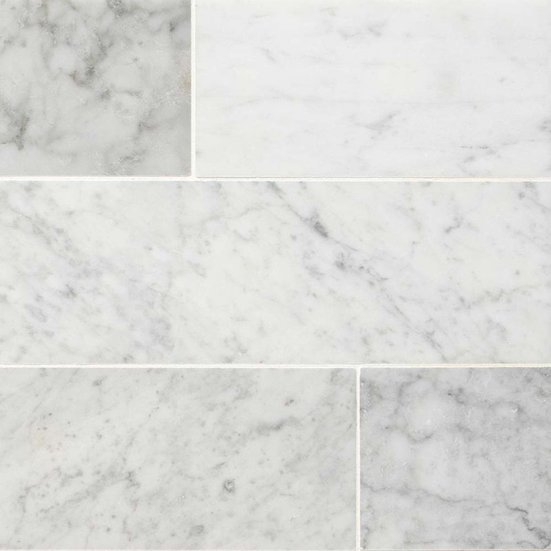 Carrara white 4 in x 12 in honed marble floor and wall tile TCARWHT412H product shot multiple tiles top view