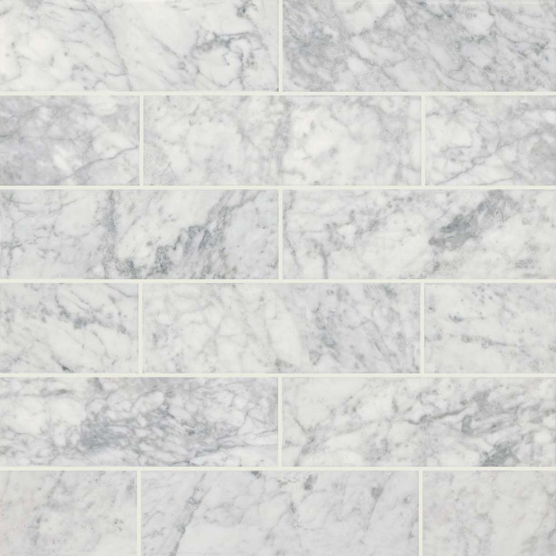 Carrara white 4 in x 12 in polished marble floor and wall tile TCARWHT412P product shot multiple tiles top view