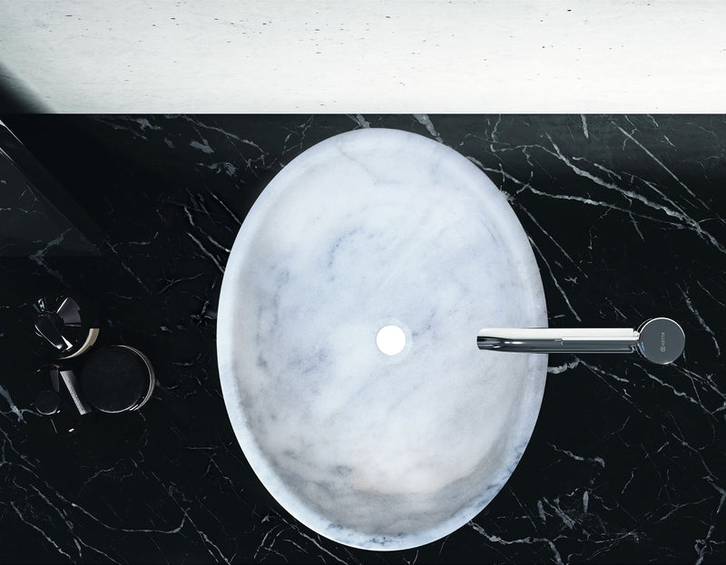 carrara white marble oval vessel sink NTRSTC04 W16 L21 H6 bathroom view over black counter wide