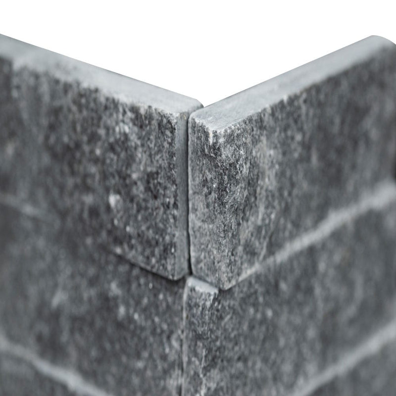 Cosmic black ledger corner 6"x18" splitface marble wall tile LPNLMCOSBLK618COR product shot angle view