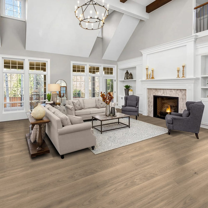 Engineered Hardwood floors strabo french white oak seneca prefinished wire brushed SHW12532WB 9in installed to a living room floor with fireplace and high ceiling