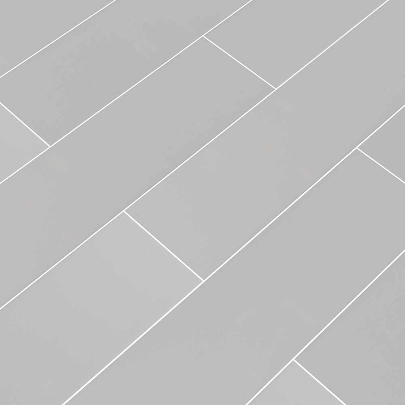 Gray glossy glazed ceramic wall tile msi collection NGRAGLO4X16 product shot multiple tiles angle view