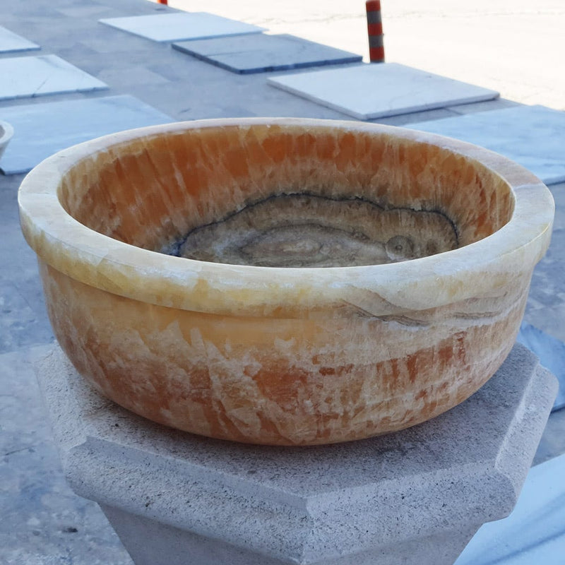 Honey Onyx marble vessel sink angle view