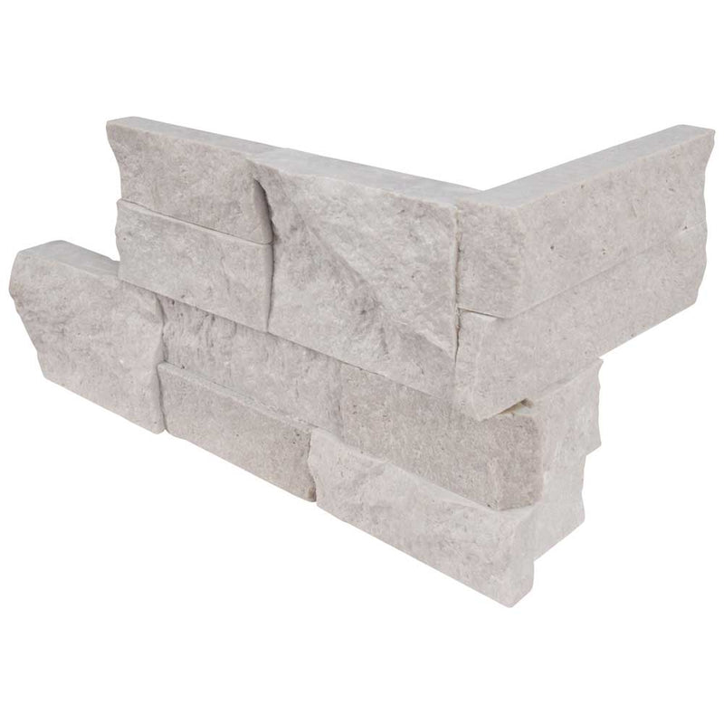 Iceland gray splitface ledger corner 6X18 natural travertine wall tile LPNLTICEGRY618COR product shot multiple tiles close up view