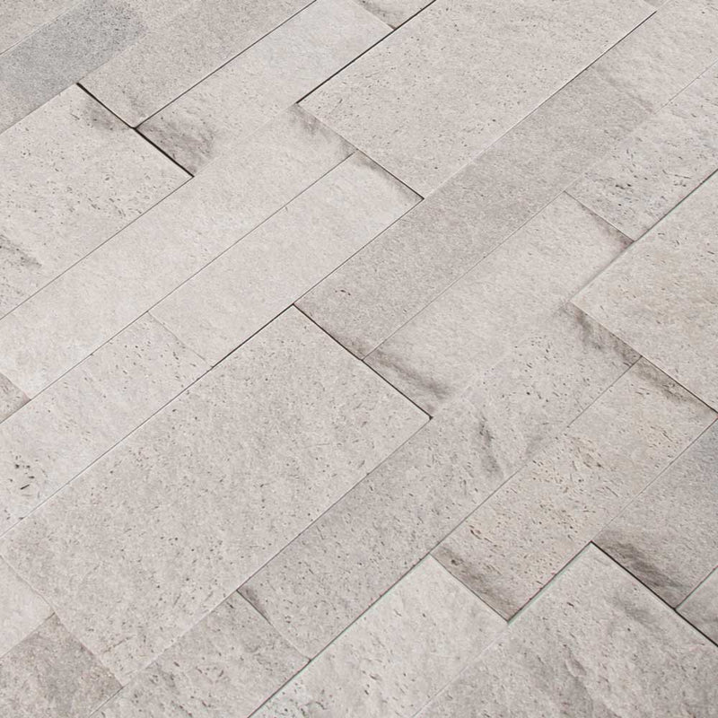 Iceland gray splitface ledger panel 6X24 natural travertine wall tile LPNLTICEGRY624 product shot multiple tiles angle view
