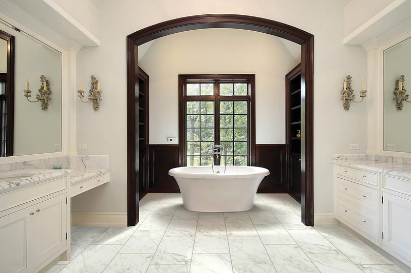 MSI Pietra Carrara 12x24 marble look glazed porcelain floor wall tile NCAR1224 room shot modern bathroom bathtub