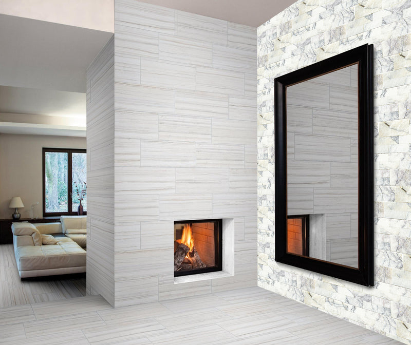 New York White Marble Ledger Panel 6x24 Natural Marble Splitface Wall Tile installed on living room wall huge mirror and modern fireplace