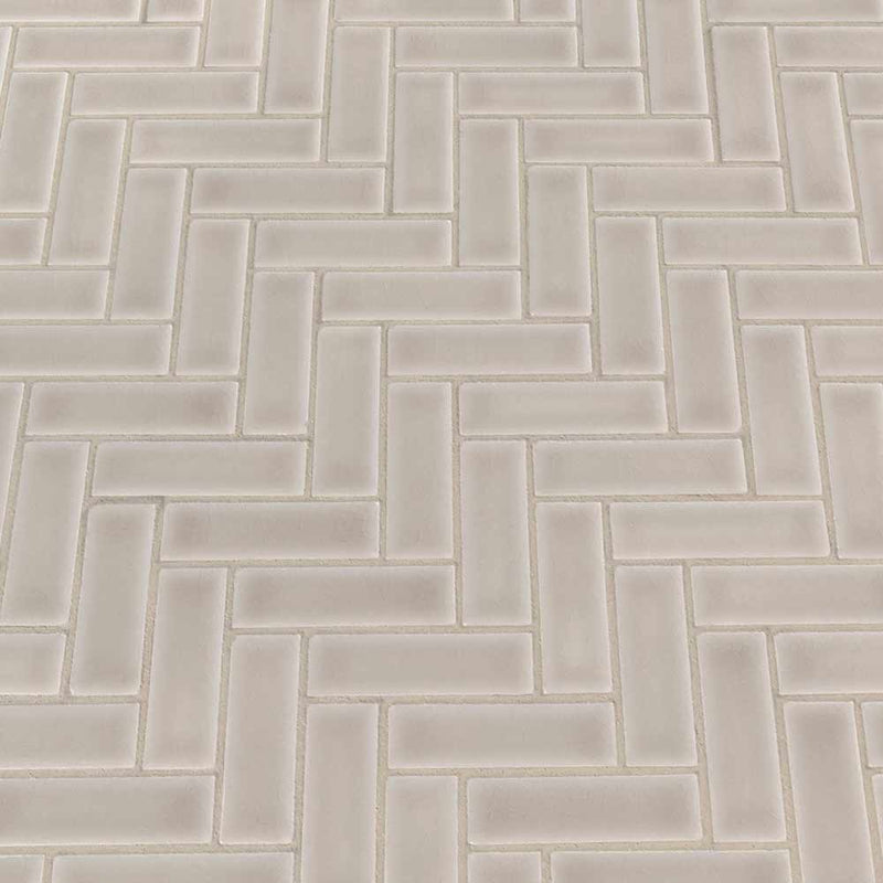 Portico pearl herringbone 11.3X12.56 glossy ceramic mesh mounted mosaic tile SMOT-PT-PORPEA-HB product shot multiple tiles angle view