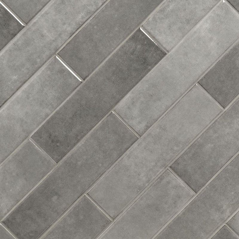 Renzo storm 3x12 glossy ceramic gray wall tile NRENSTO3X12 product shot multiple tiles angle view