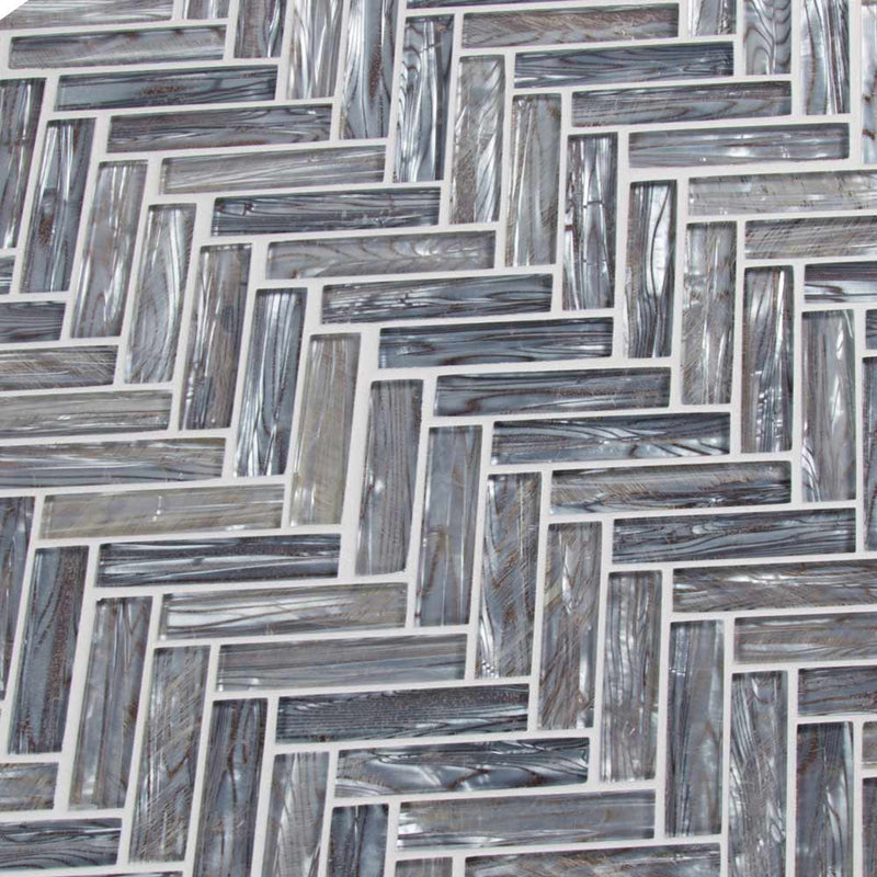 Shimmering silver herringbone 11.06X12.6 glass mesh mounted mosaic tile SMOT GLS SHISLV8MM product shot multiple tiles angle view